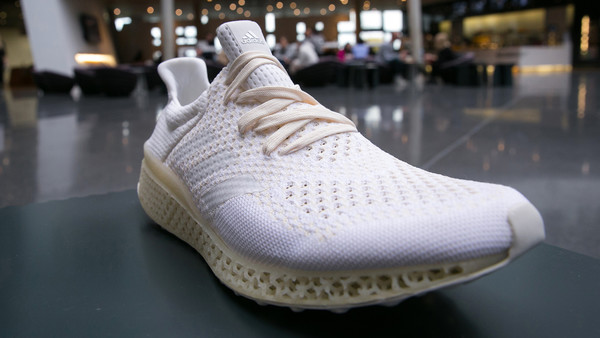 An Adidas prototype sneaker with a 3D printed sole sits on display ahead of a news conference to announce Adidas AG's earnings in Herzogenaurach, Germany, on Thursday, March 3, 2016. German sport-shoe maker Adidas forecast sales and earnings to increase as much as 12 percent this year as consumers spend more ahead of the Euro 2016 soccer tournament. Photographer: Krisztian Bocsi/Bloomberg