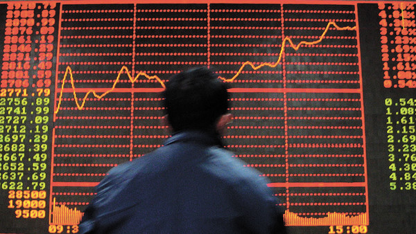 BEIJING, CHINA - FEBRUARY 28: (CHINA OUT) A man watches a screen as the Chinese stocks stabilized on February 28, 2007 as buying by local funds in financial blue chips pushed up the main Shanghai index, after the country's stock market suffered its steepest daily fall in the past decade, with the benchmark Shanghai Composite Index plunging nearly 9 percent to close at 2,771 on February 27, 2007.