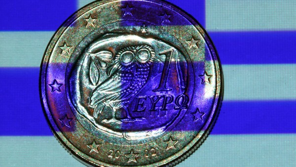 EU/IMF inspectors in Greece as eurozone exit fears grow...epa03316123 An illustration showing a Greek flag projected onto a Greek one euro coin in Schwerin, Schwerin,†Germany, 24 July 2012. International creditors will on 24 review Greece's troubled austerity programme at a time of renewed concern about the country's future in the eurozone. The new conservative-led coalition government is scrambling to come up with 2.5 billion euros (3 billion dollars) more in savings to meet the target of 11.5 billion euros set by the European Union and the International Monetary Fund (IMF) for 2013 and 2014. Among the measures recommended by the Center of Planning and Economic Research (KEPE) pension cuts worth an estimated total of 5.1 billion euros. EPA/JENS BUETTNER