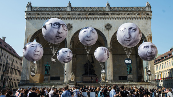 MUNICH, GERMANY - JUNE 05: Activists have installed balloons decorated with the portraits of (L-R) Japanese Prime Minister Shinzo Abe, French President Francois Hollande, Italian Prime Minister Matteo Renzi, German Chancellor Angela Merkel, Canadian Prime Minister Stephen Harper, British Prime Minister David Cameron and US President Barack Obama during a protest activity against the G7 summit on June 5, 2015 in Munich, Germany. Germany will host the G7 summit at Elmau Castle near Garmisch Partenkirchen, southern Germany, on June 7 and June 8, 2015. (Photo by Joerg Koch/Getty Images)