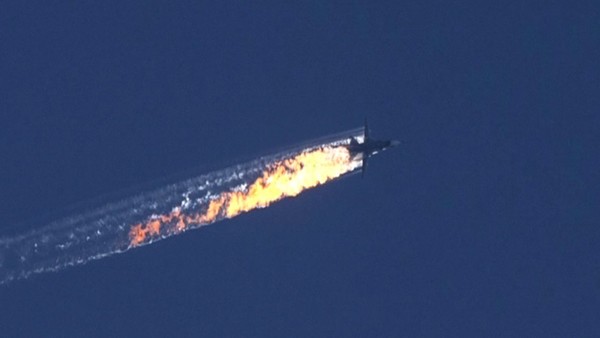 epa05039461 A still image made available on 24 November 2015 from video footage shown by the HaberTurk TV Channel shows a burning trail as a plane comes down after being shot down near the Turkish-Syrian border, over north Syria, 24 November 2015. A Russian fighter jet was shot down 24 November over the Turkish-Syrian border, the Defence Ministry in Moscow said, according to Interfax news agency. The Sukhoi Su-24 was reportedly downed by Turkish forces, Turkish state news agency Anadolu reported, citing sources in the presidency. The report said that the jet violated Turkish airspace and ignored warnings. It crashed in the north-western Syrian town of Bayirbucak, Turkish security sources were quoted as saying. EPA/HABERTURK TV CHANNEL MANDATORY CREDIT: HABERTURK TV CHANNEL
