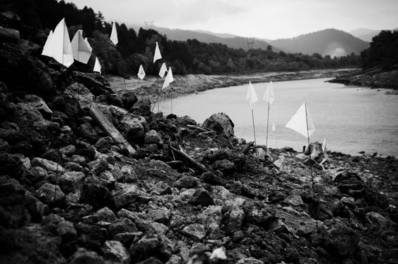 White flags mark the spots where skeletons were found in Visegrad