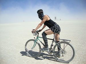 April Dembosky on a bike in the desert at the Burning Man festival in Nevada