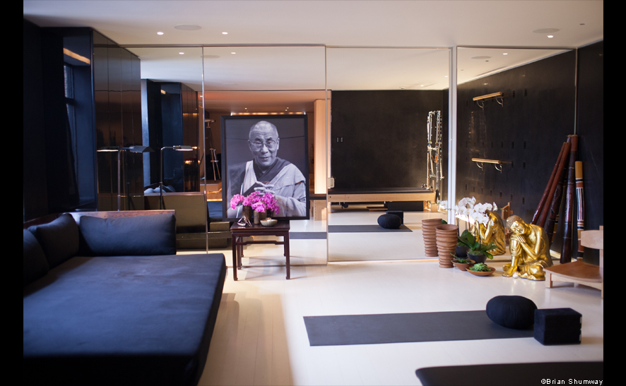 Donna Karan’s yoga studio with a portrait of the Dalai Lama