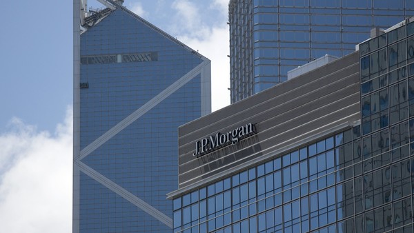 Signage for JP Morgan Chase and Co. is displayed on a building in the business district of Central, Hong Kong, China, on Tuesday, June 19, 2013. Photographer: Jerome Favre/Bloomberg