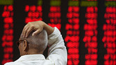 An investor watches stock price movements at a securities company in Beijing on June 15, 2016. China on June 15 brushed off stock index firm MSCI's decision to exclude the country's A shares from its influential global equities index, saying that the gauge cannot be complete without the Chinese stocks. / AFP / GREG BAKER (Photo credit should read GREG BAKER/AFP/Getty Images)