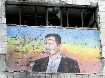 A portrait of Bashar al-Assad in Aleppo after parts of the city were captured by rebels, March 2013