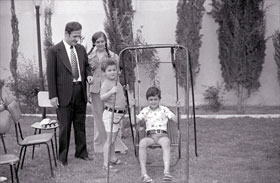 Bashar (on swing) in 1974 with his father Hafez, brother Majd and sister Bushra